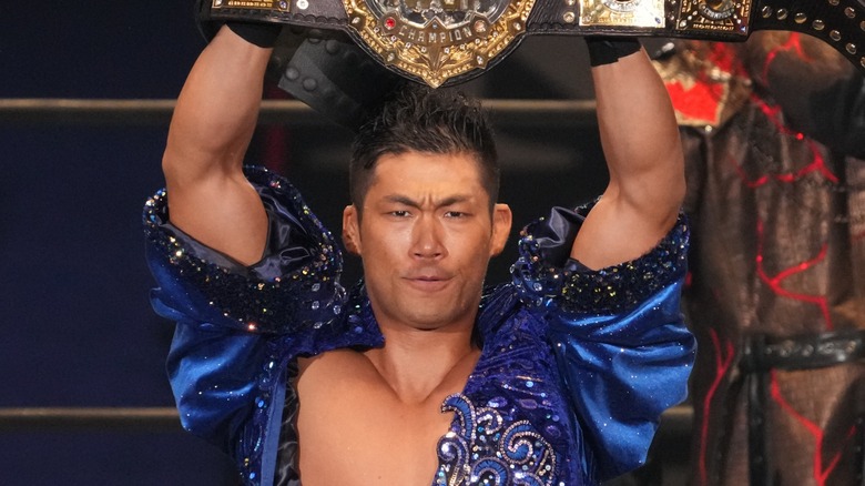 IWGP World Heavyweight Champion SANADA holds his title high