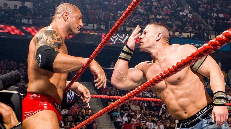 John Cena taunting Batista in his face during a match on 