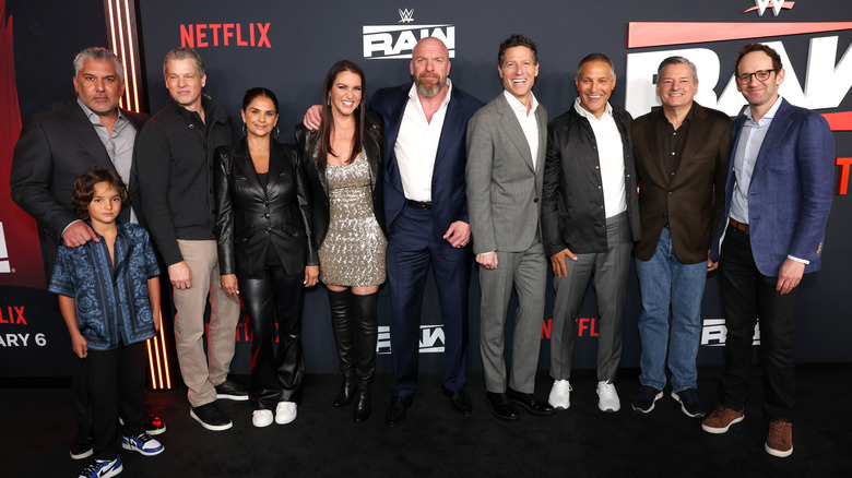 Triple H, Stephanie McMahon, WWE President Nick Khan, President of TKO Ari Emanuel, and others join together in a group photo at the "WWE Raw" premiere on Netflix