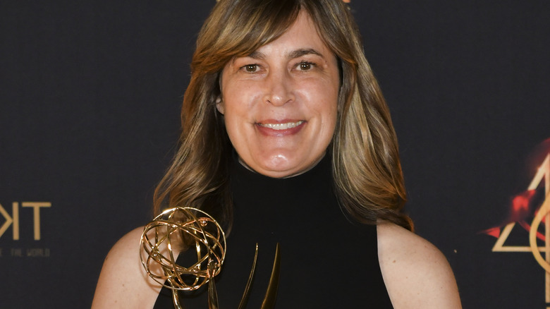 Jennifer Pepperman holding an Emmy