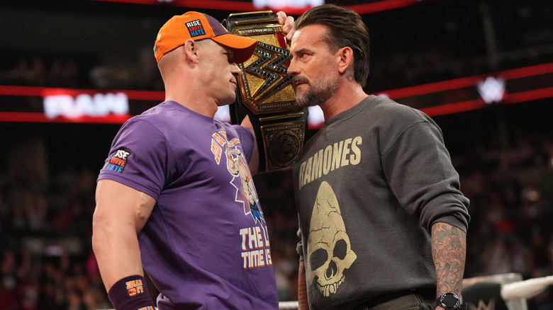 John Cena and CM Punk have a staredown before making their title match official