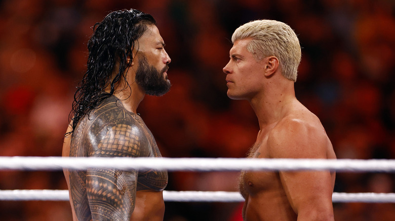 Roman Reigns and Cody Rhodes stare each other down