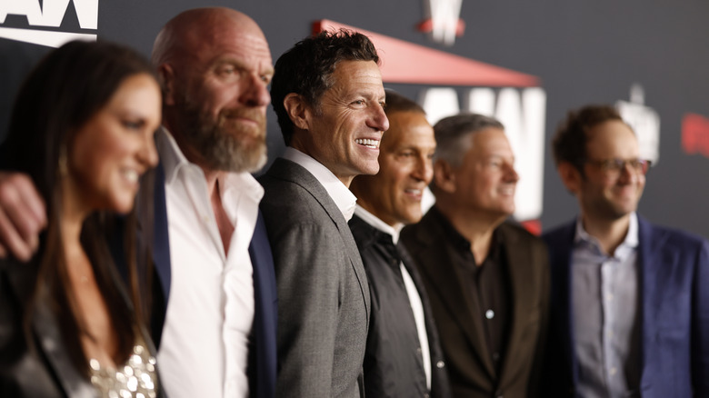 Stephanie McMahon, Triple H, TKO's Mark Shapiro (President) and Ari Emanuel (Chief Executive Officer) all pose together ahead of the 