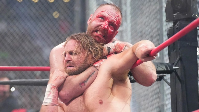 Jon Moxley chokes out Adam Page during Blood & Guts