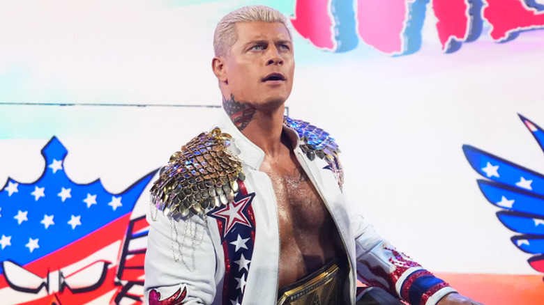Cody Rhodes wearing a white ring jacket
