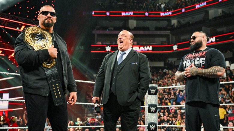 Paul Heyman roars on as he watches a composed Bron Breakker carry the WWE World Heavyweight Championship with Bronson Reed standing by