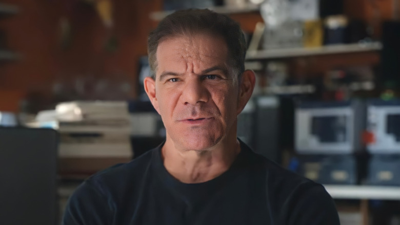 Dave Meltzer on camera in his office, speaking as part of the Mr. McMahon Netflix docuseries