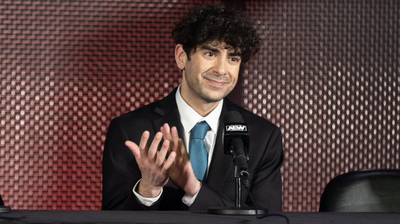 Tony Khan speaking at a press conference
