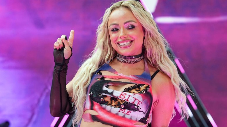 WWE Women's World Champion Liv Morgan smiles on the stage before heading down the ramp to the ring for her WWE SummerSlam 2026 match against IYO SKY.