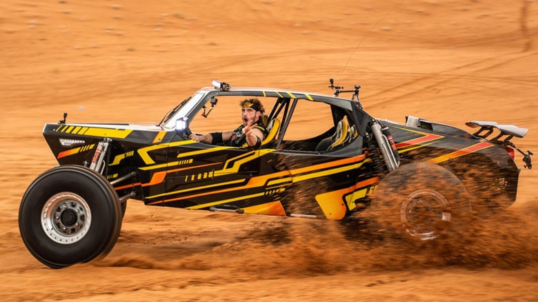 Logan Paul rides a dune buggy at WWE Crown Jewel