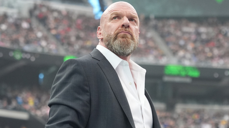 Triple H is wearing a suit