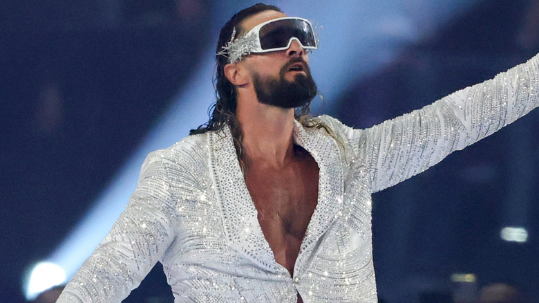 Seth Rollins is wearing a silver sparkly jacket