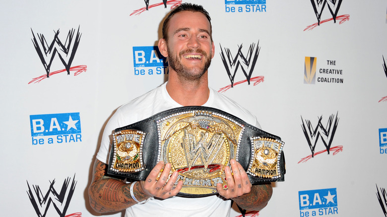 CM Punk with the WWE Championship