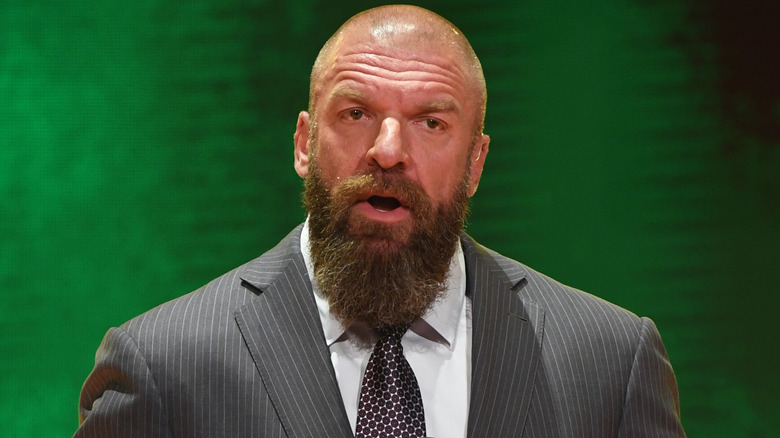 Triple H wearing a suit