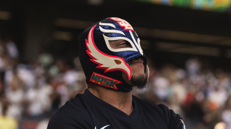 Rey Mysterio wearing a mask that says mask on it