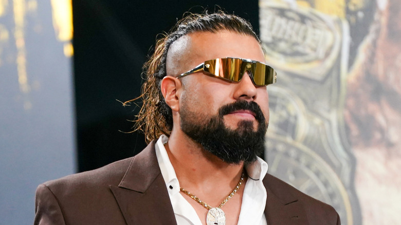 Andrade walks onto the stage during the WWE Money in the Bank Kickoff show