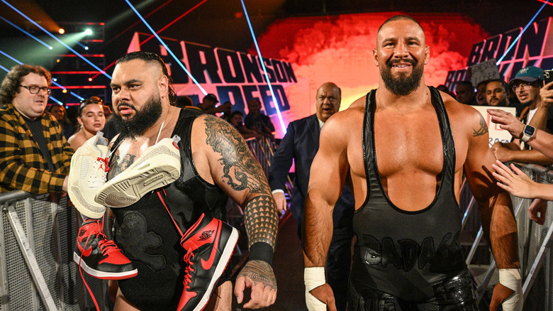Bronson Reed and Bron Breakker make their entrance with Paul Heyman during Monday Night RAW at Centre Videotron on August 11, 2025 in Quebec City, Canada.