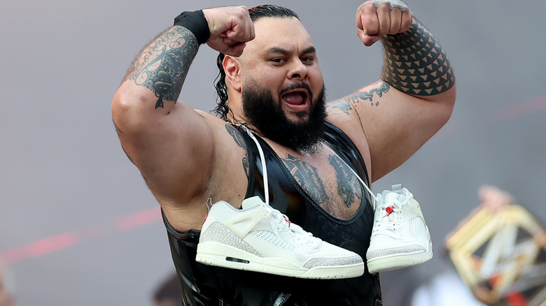 Bronson Reed wearing shoes around his neck