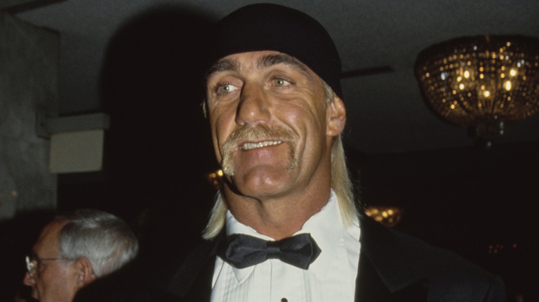 Hulk Hogan wearing a tuxedo and a black bandana