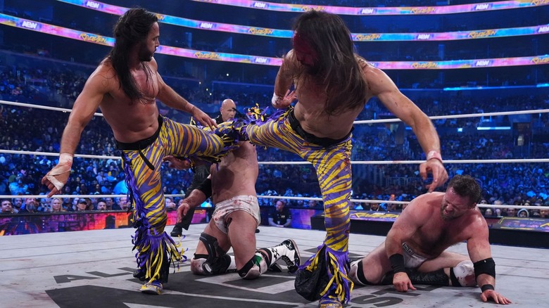 The Young Bucks with FTR in the ring