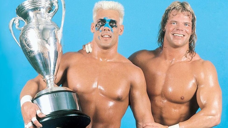 Sting and Lex Luger posing together after winning the 1988 Crocket Cup.