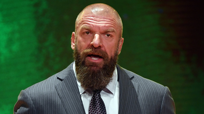 Triple H speaking to the press