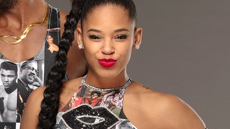 Montez Ford and Bianca Belair pose for a studio portrait