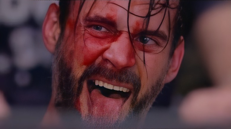 CM Punk doing his 'Go To Sleep' pose inside the ring