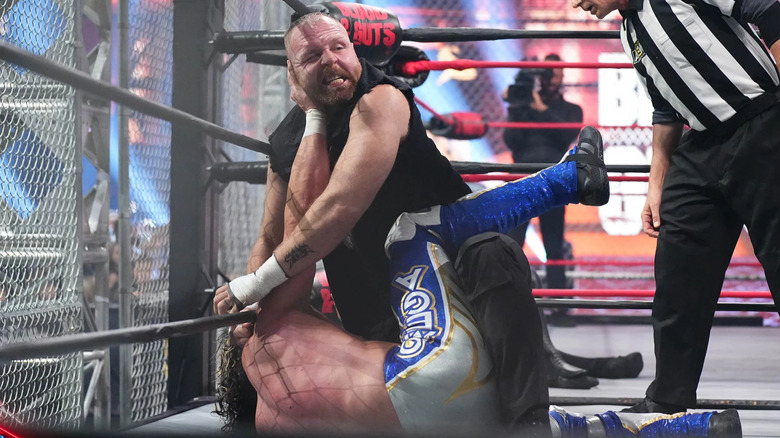 Jon Moxley attacks Kenny Omega during Blood & Guts