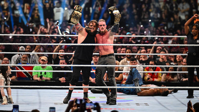 Dexter Lumis & Joe Gacy with the tag titles at Clash in Paris