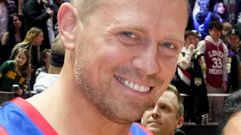 The Miz smiles at a basketball game