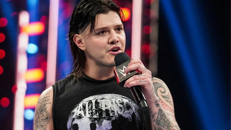 Dominik Mysterio talking into microphone