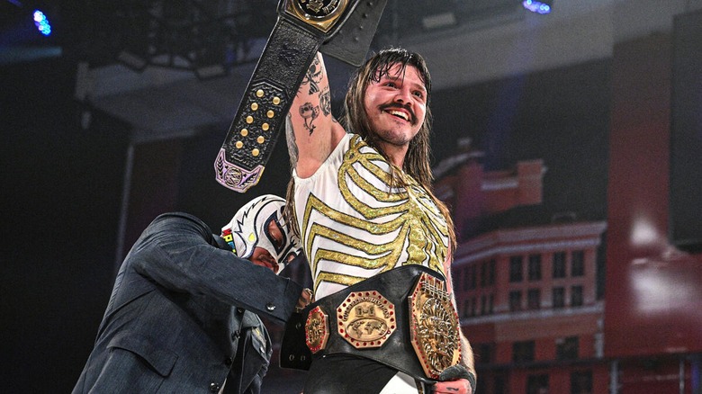 Rey Mysterio crowning Dominik Mysterio as the AAA Mega Champion at Worlds Collide 2025.