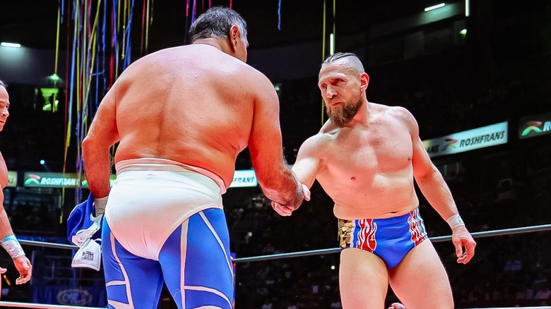 Blue Panther and Bryan Danielson shake hands