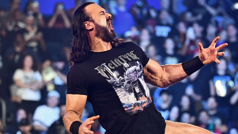 Drew McIntyre looks to the crowd while delivering a promo in the ring during an episode of WWE TV.