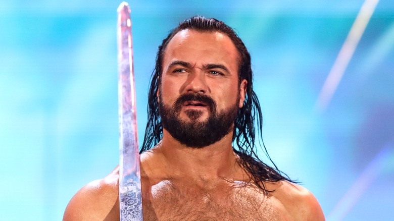 Drew McIntyre carrying sword