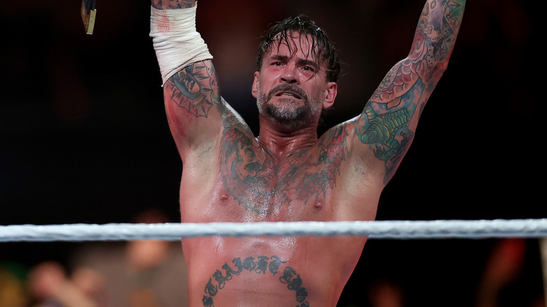 CM Punk raising his arms in victory