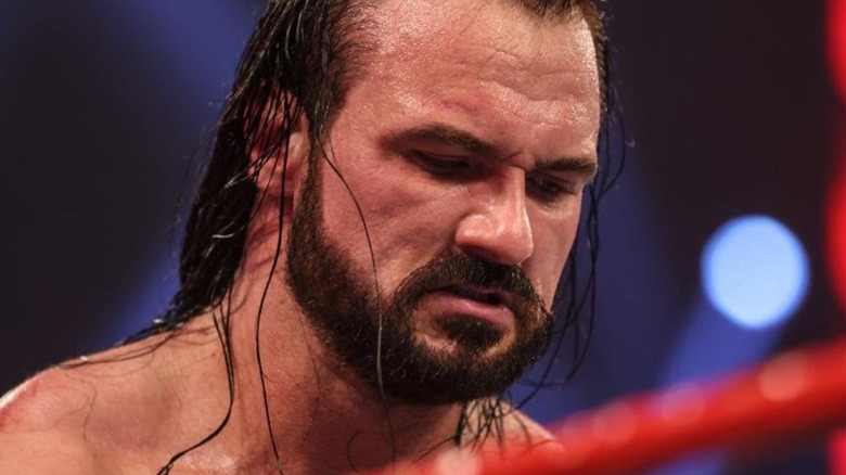 Drew McIntyre looks down during a match