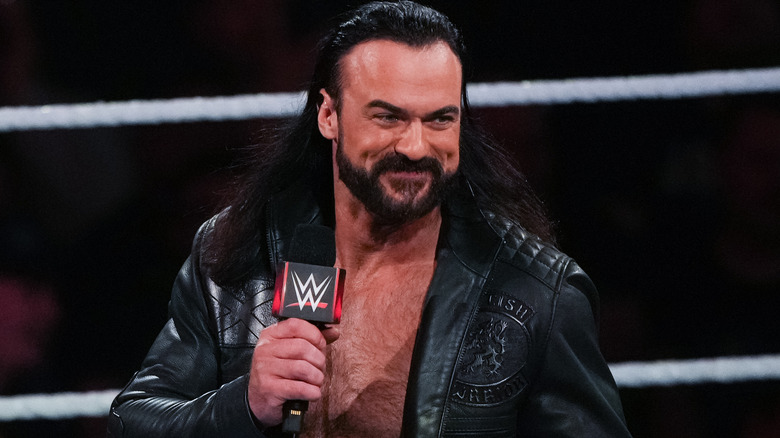 Drew McIntyre holding a microphone