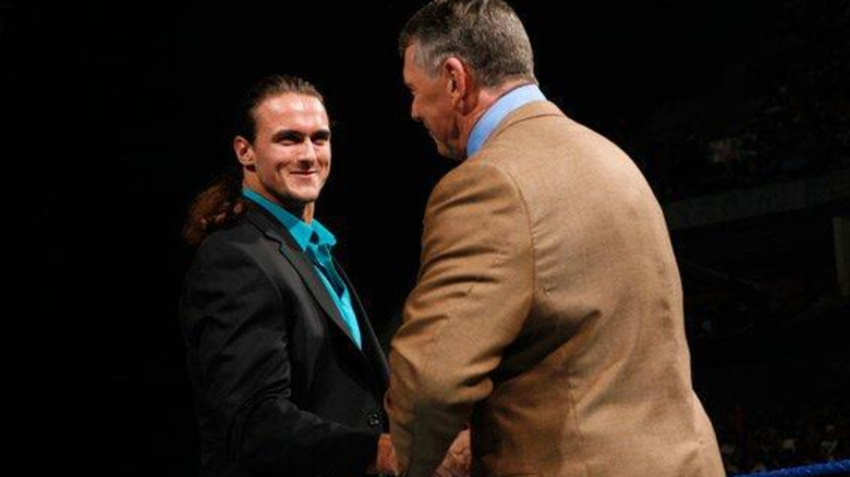 Drew McIntyre shaking Vince McMahon's hand