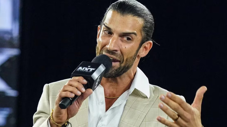 Robert Stone holding a microphone