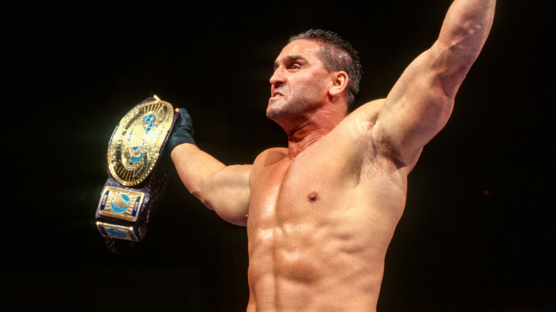 Ken Shamrock celebrates with the WWE Intercontinental Championship