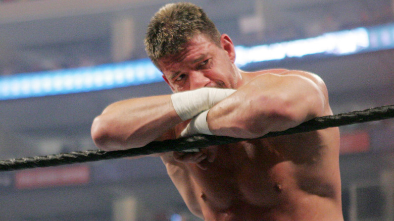 Eddie Guerrero leaning on the ropes upset after his match against Rey Mysterio at WrestleMania 21.