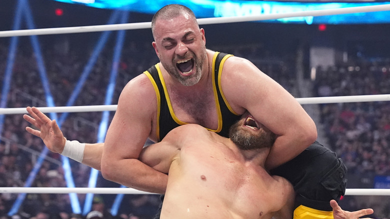 Eddie Kingston puts Bryan Danielson in a submission in the middle of the ring during a match at AEW Revolution in March 2024.
