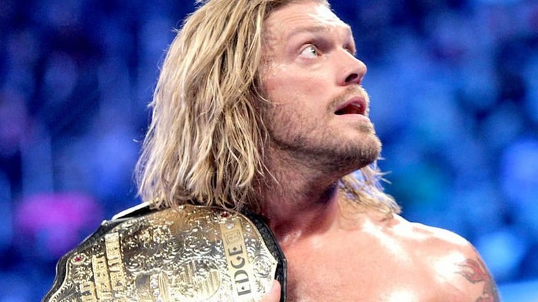 Edge holding his Championship