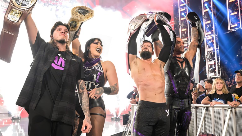 The Judgment Day holding up their title belts