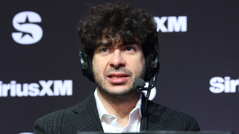 AEW's Tony Khan wearing a headset