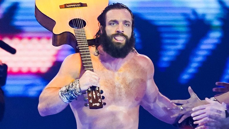 Elijah carrying a guitar