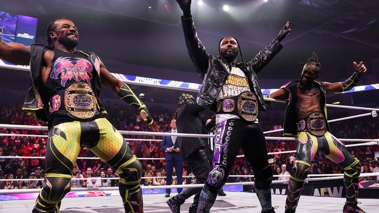 Austin Creed, Swerve Strickland, and Kofi (with Prince Nana in the ring) during their first entrance on 