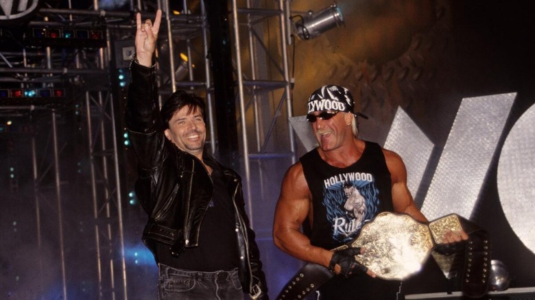 Eric Bischoff and Hulk Hogan making their way to the ring together as the New World Order in WCW.